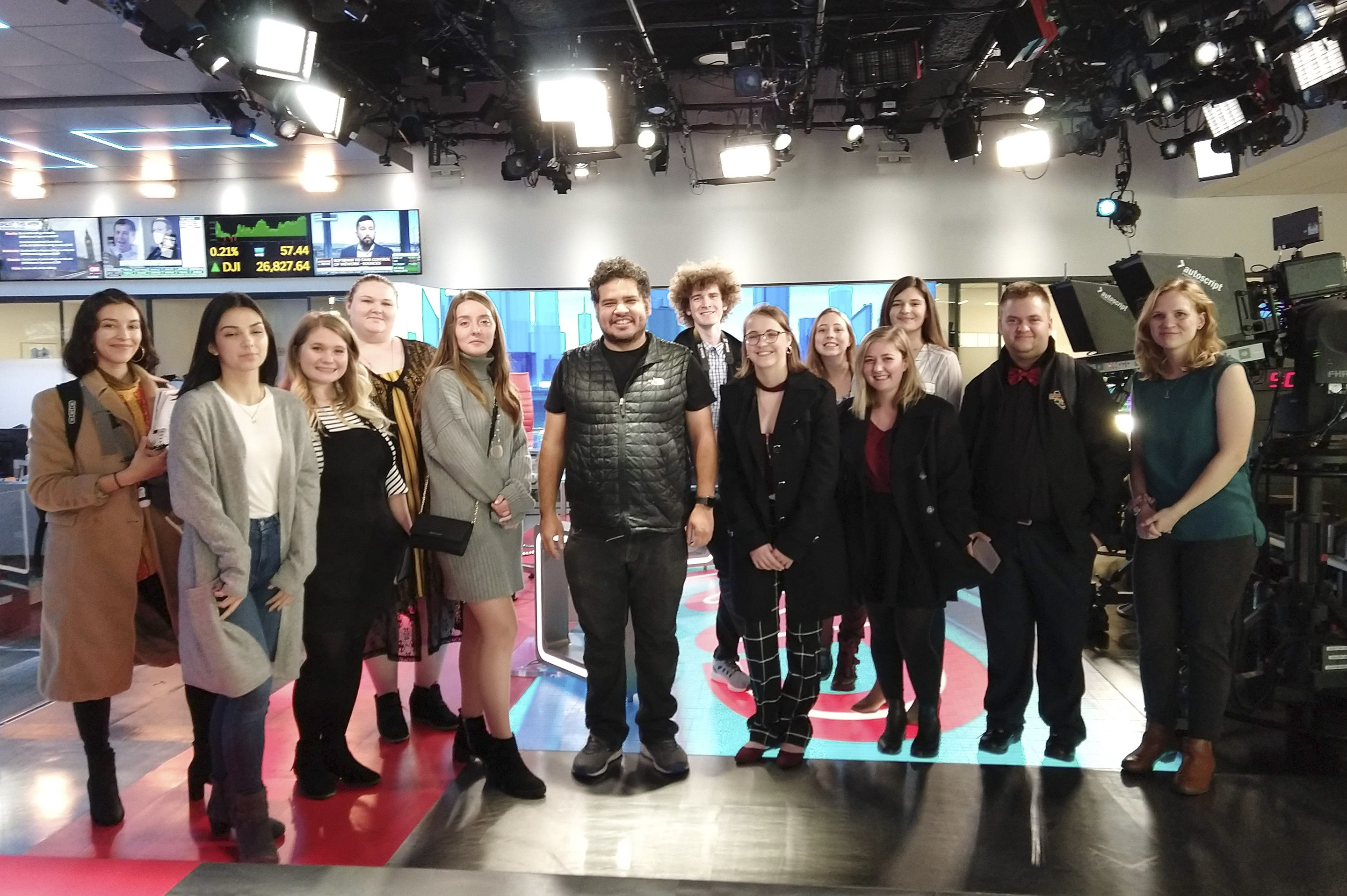 Photojournalism students pose for a photo in CNN's studios.