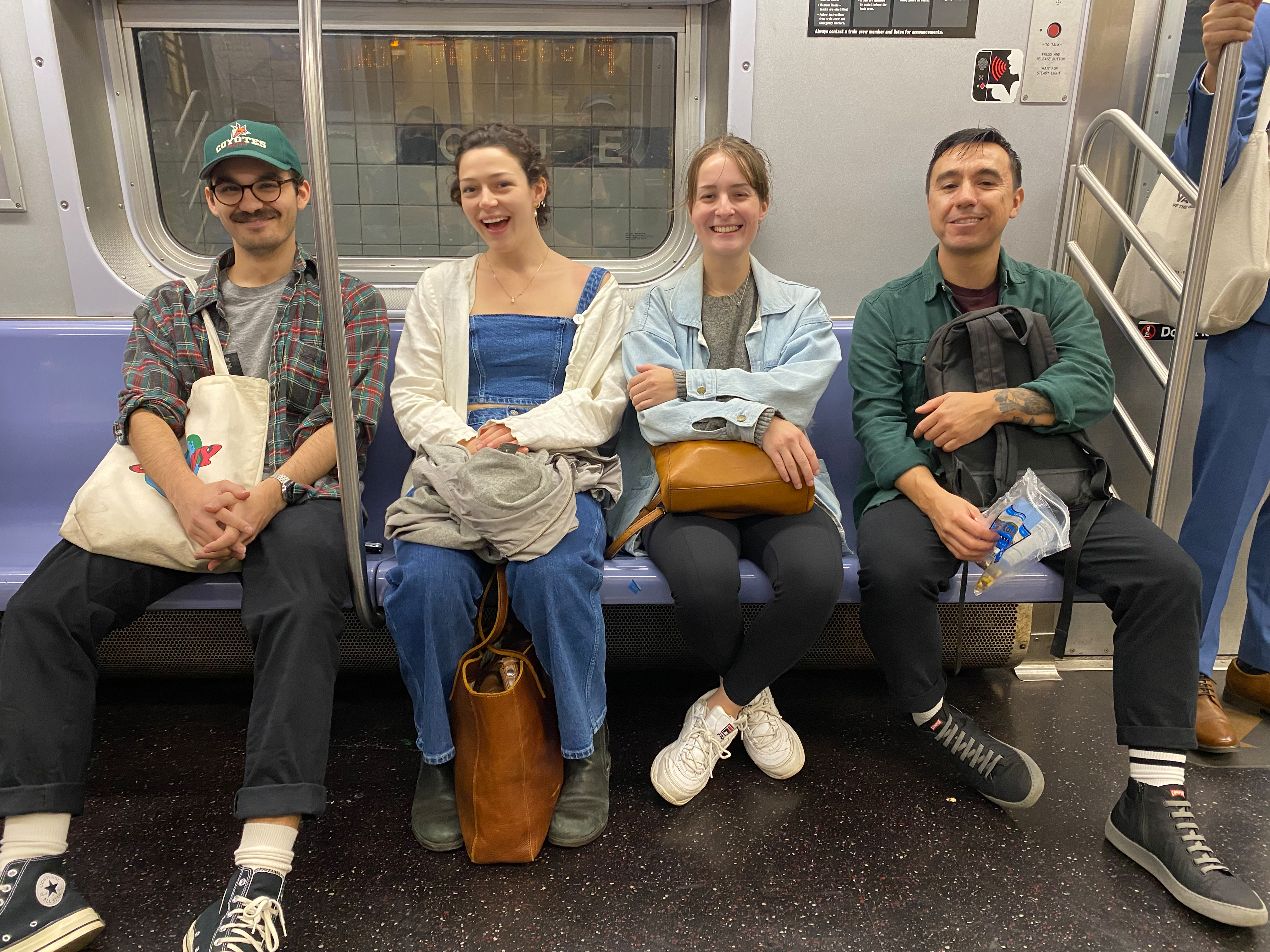 RIT photography students Justin Aungst, Nell Pittman, Madelyn Lohman and Louis Chavez on a train.