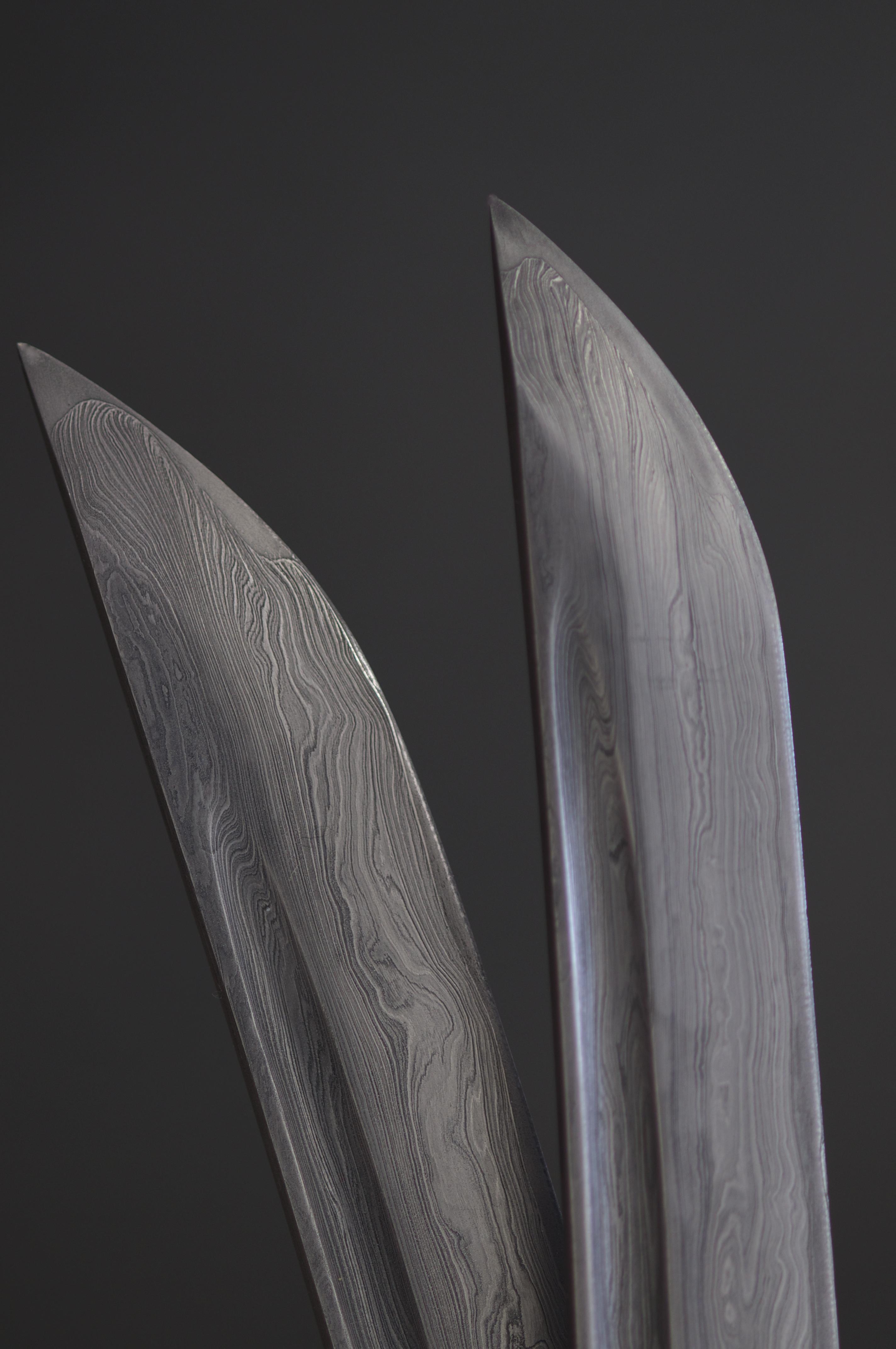 A photo of two objects that look like interlocking blades.