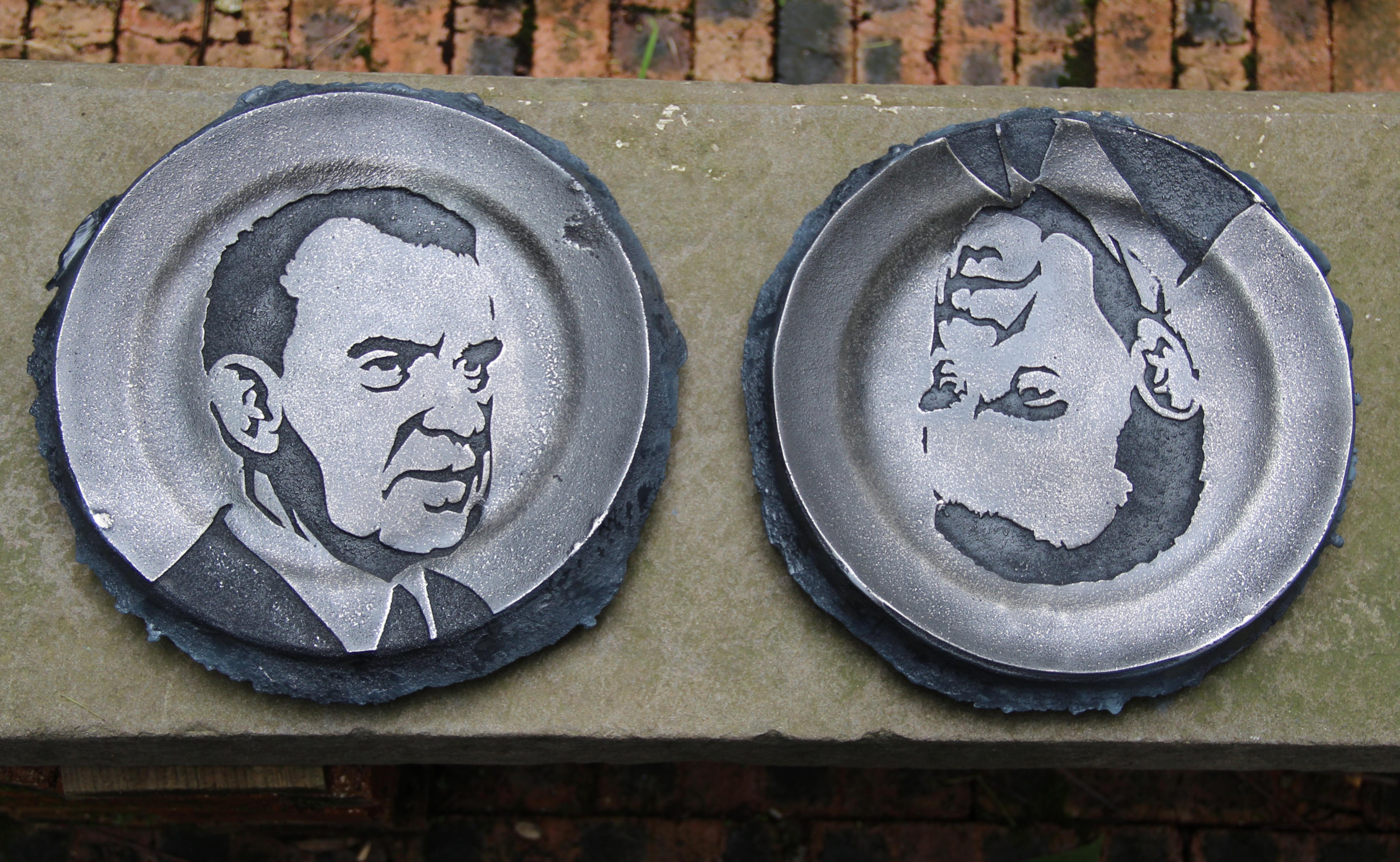 Two plates with the face of a man.