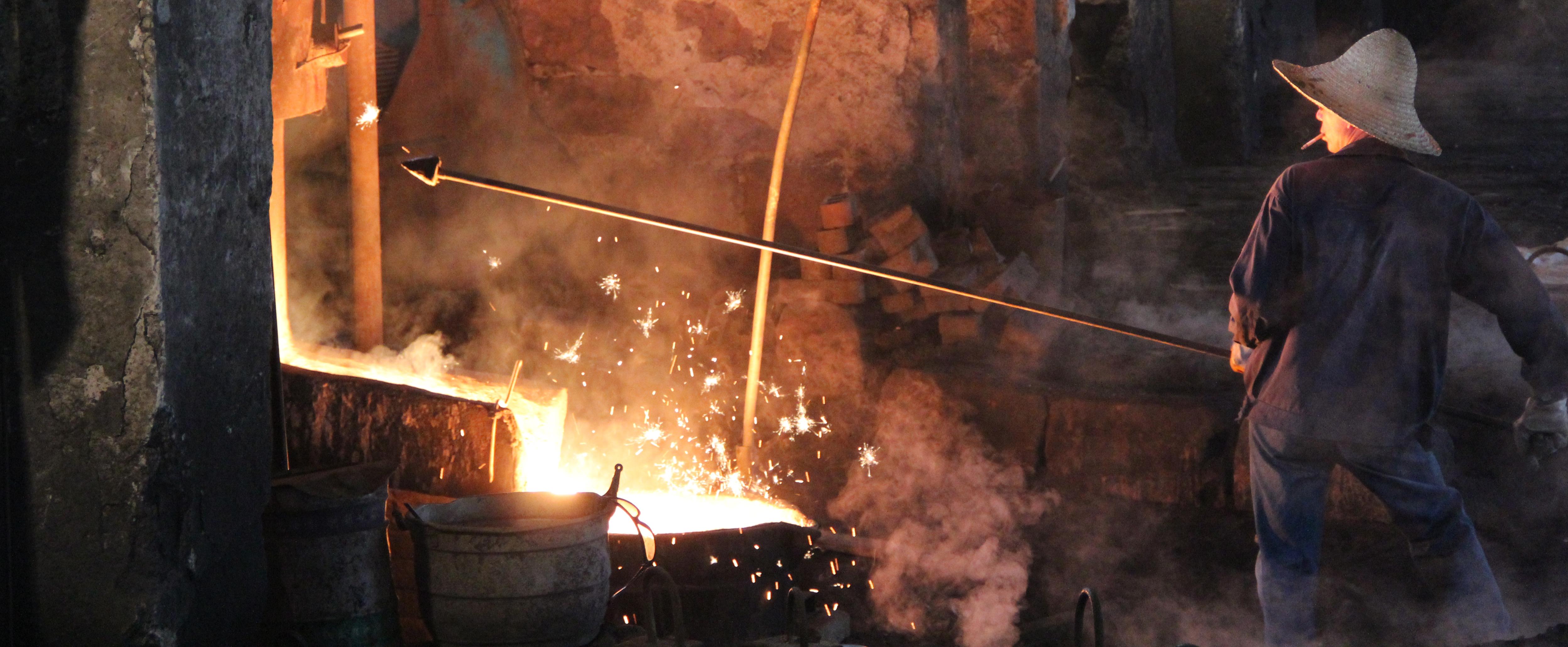 Elizabeth Kronfield operates in a foundry with molten iron.