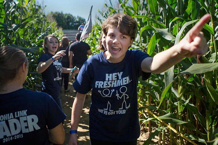 A group of kids in a cornfield.