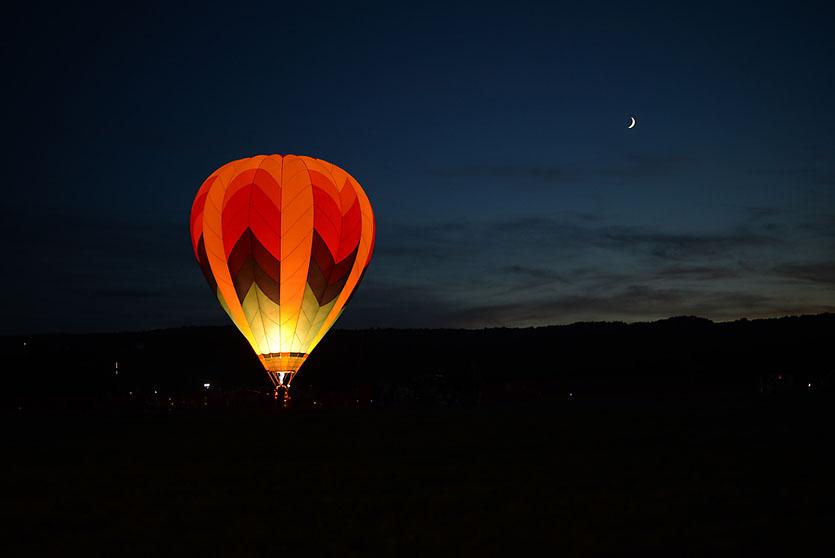 A hot air balloon set against the night sky.