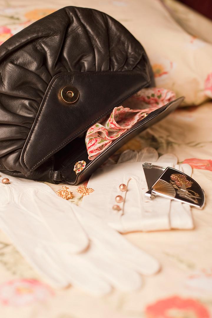 A photo of an open purse with contents spilling out.