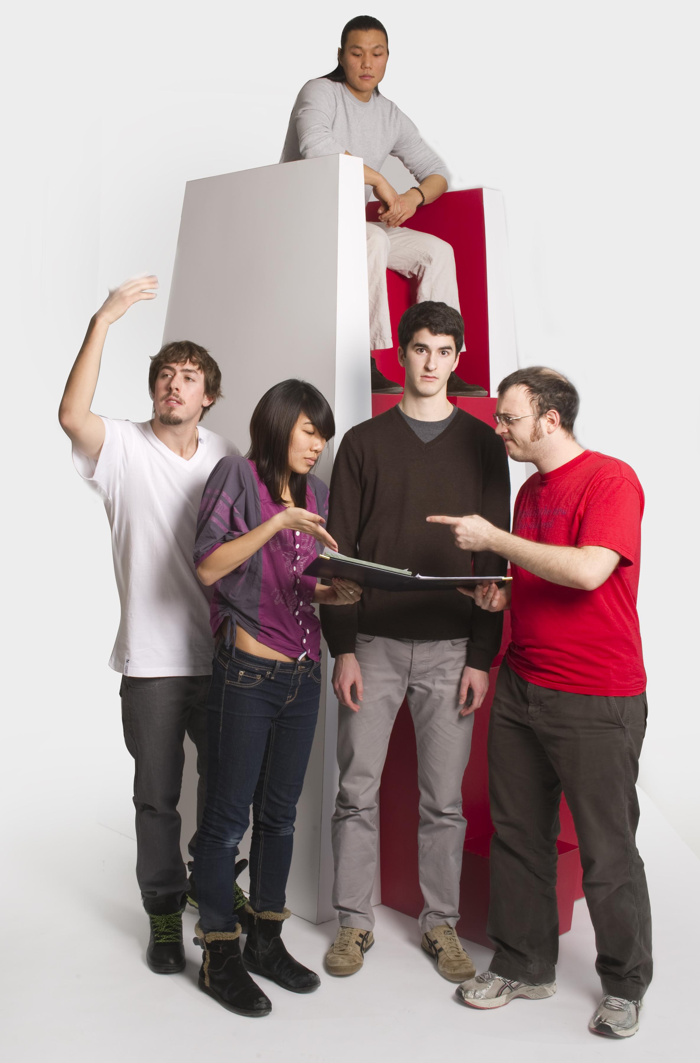 A group of people use a vertically-oriented chair design.