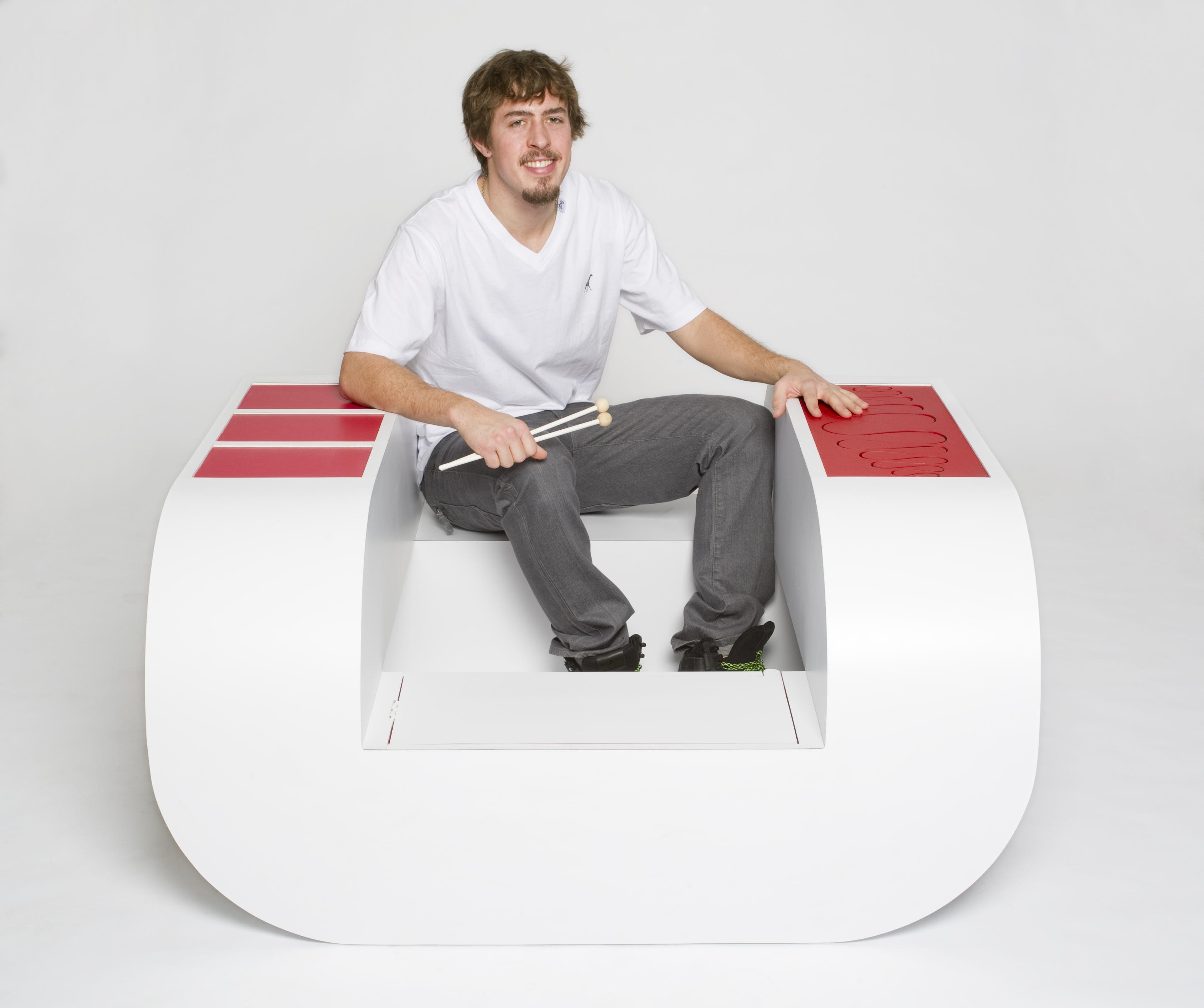 A play bench design being used by a man.