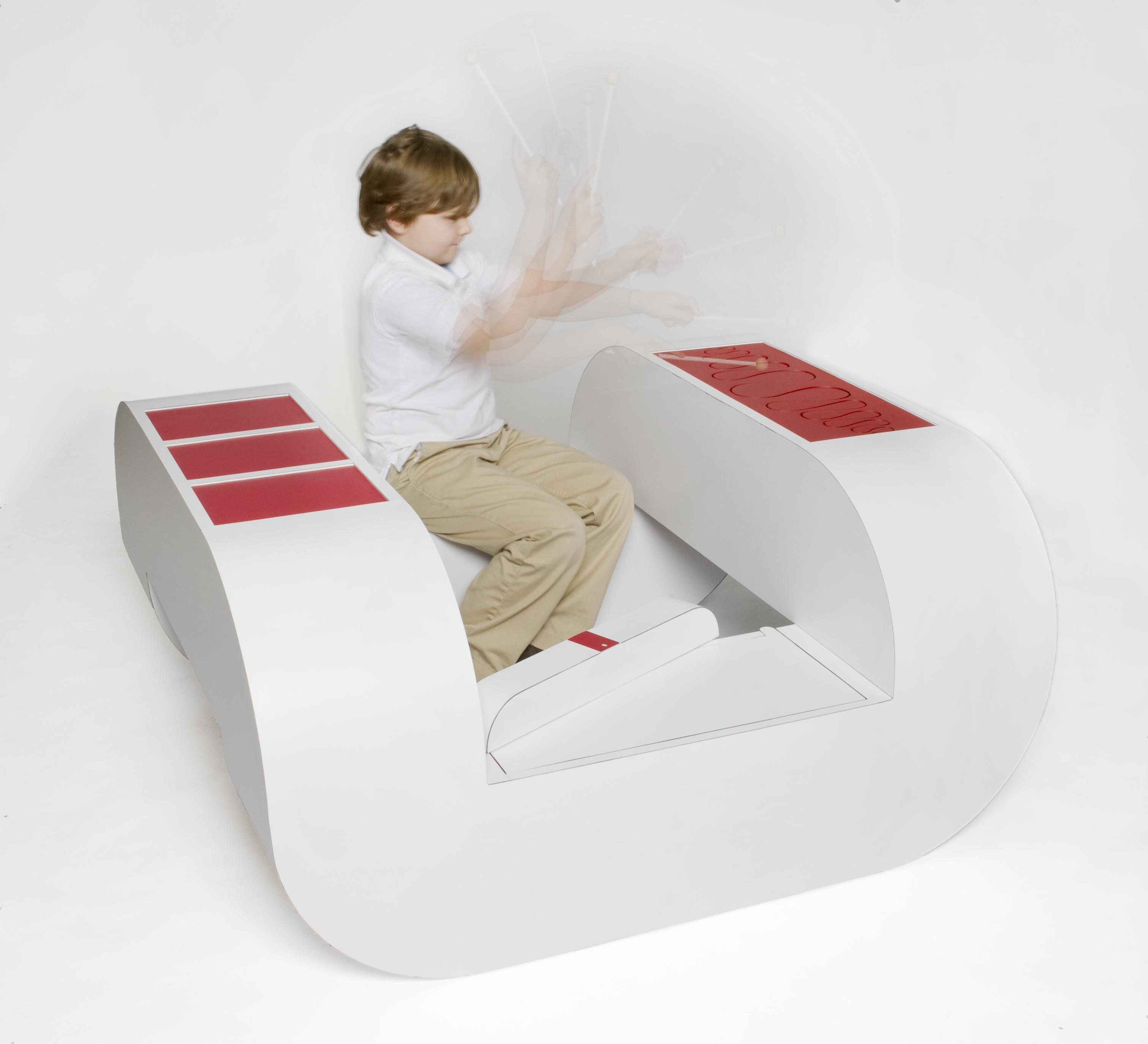 A play bench design being used by a child.
