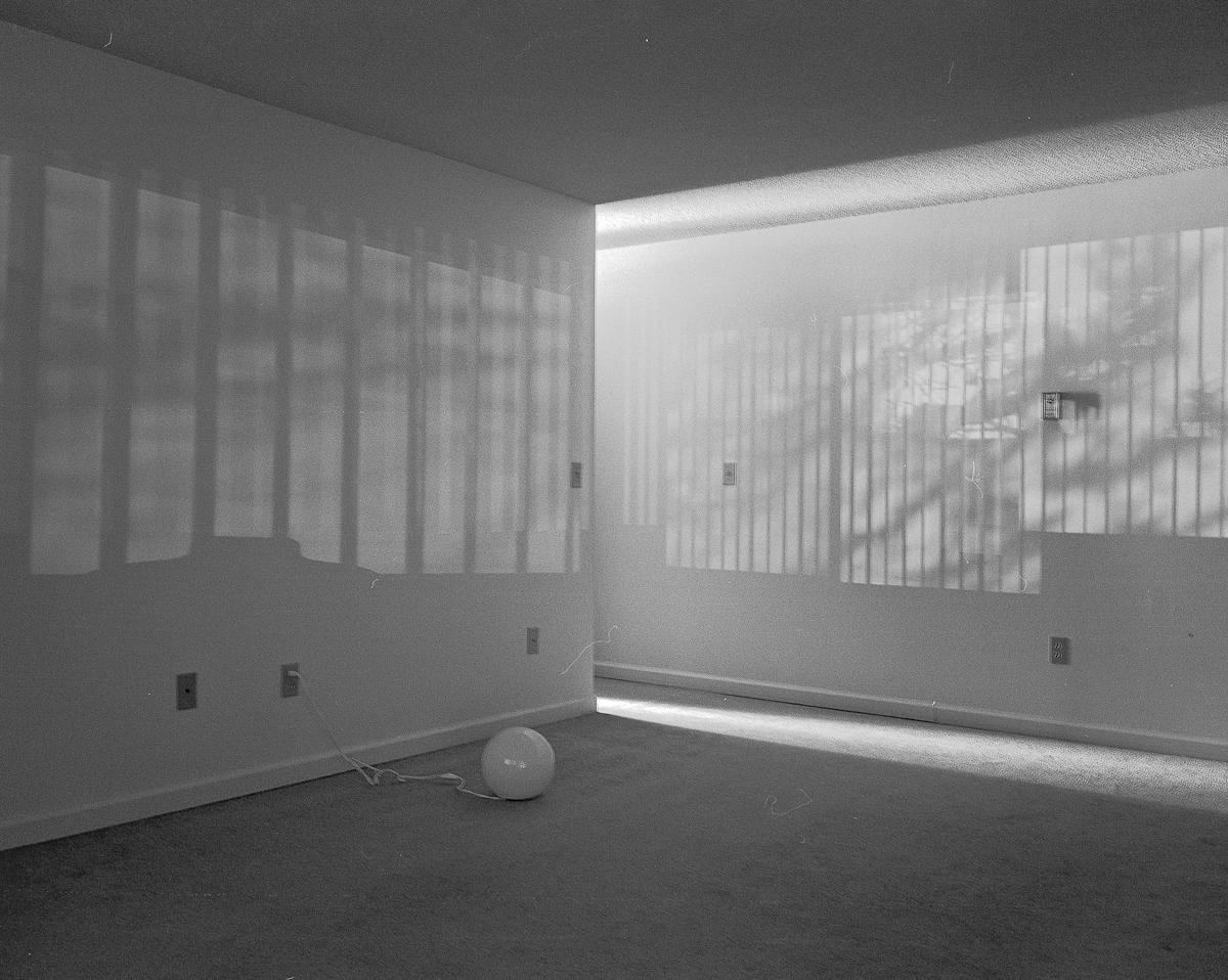 A black and white photo of walls in a building.