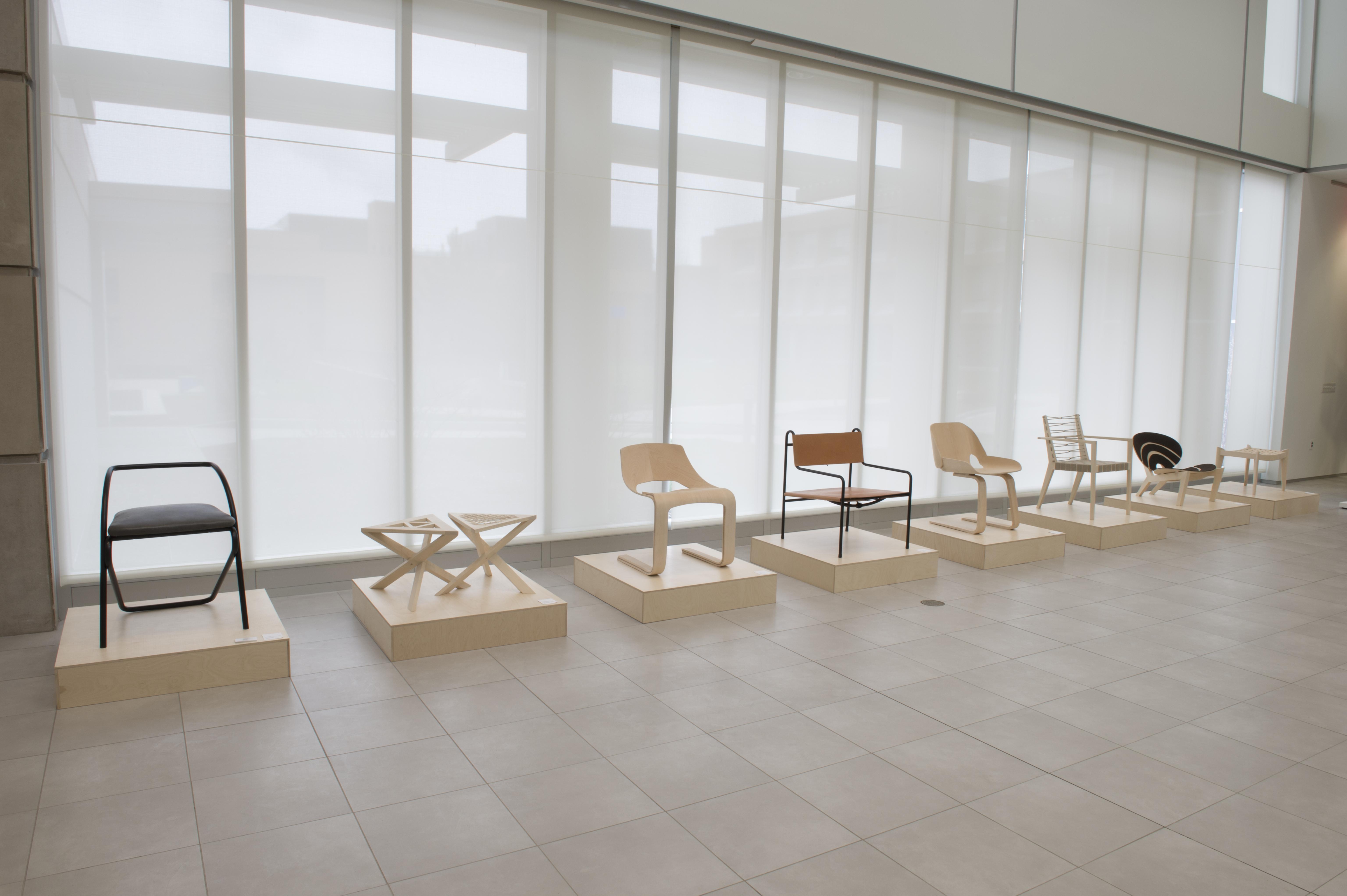 A line of crafted furniture in University Gallery.