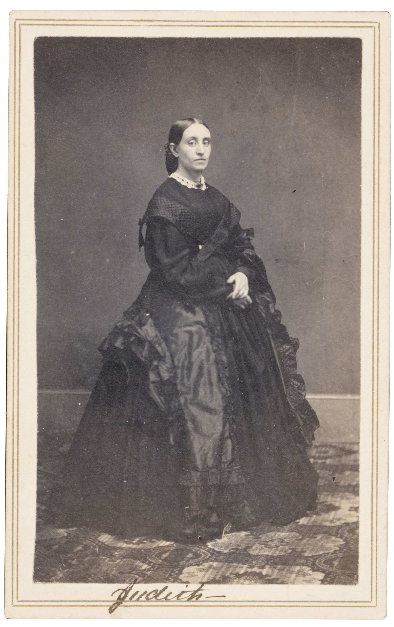 This image exhibits a purple-black image tone. Albumen prints are typified by yellow highlights and a warm image tone.