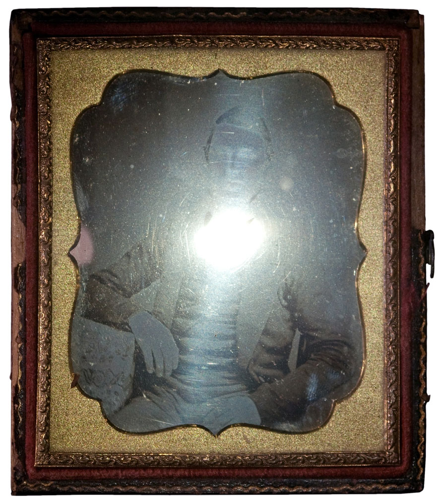 Daguerreotypes have a high gloss surface sheen. They are polished to a mirror-like shine making them highly reflective. 